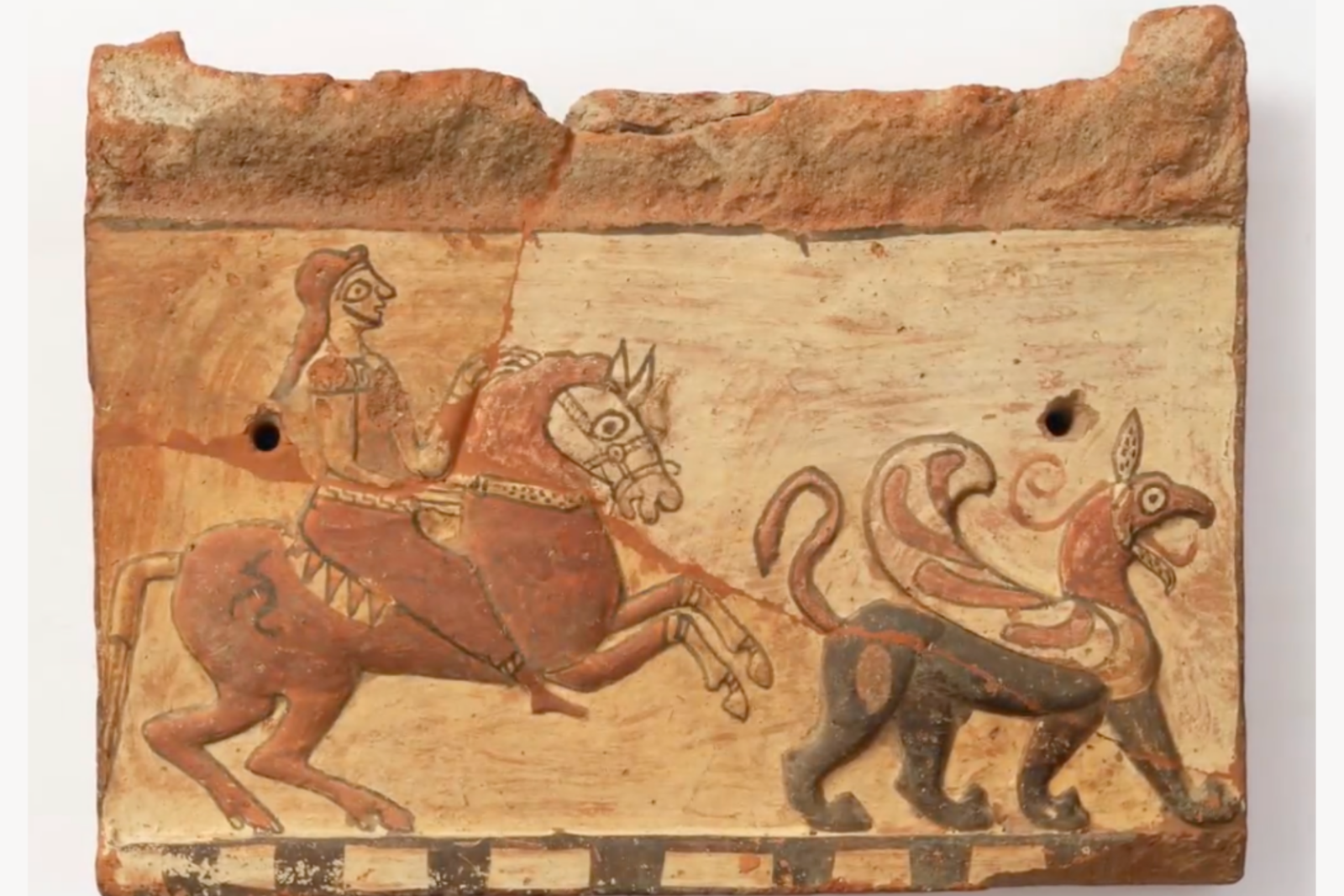 Duver terracotta plaque showing a horseman and a mythical creature, a significant artifact from the Pisidia region