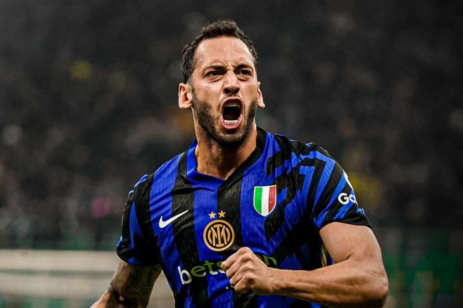 Hakan Calhanoglu stays focused in action during Inter