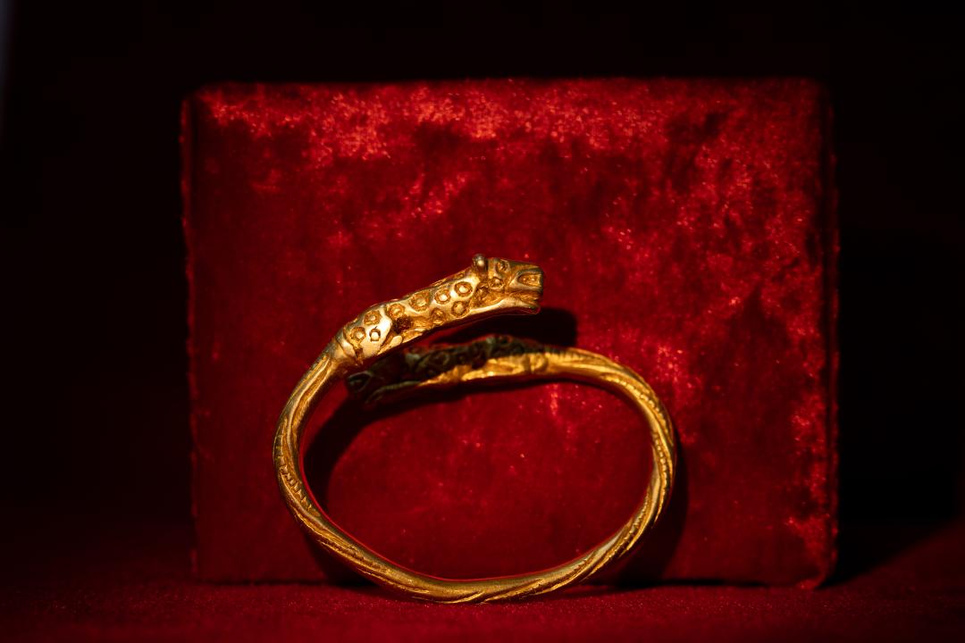 A leopard-depicted bracelet from Sarmatian-era burial sites on display at the Atrau Regional History Museum.