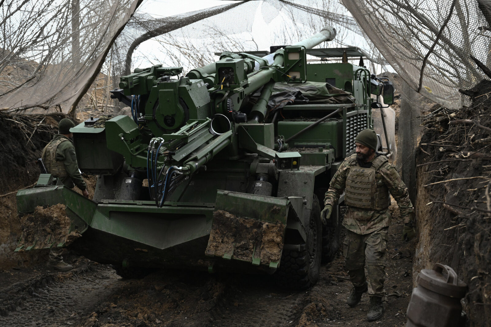 Artillerymen of the 155th Separate Mechanized Brigade of Ukrainian Armed Forces prepare to fire a French-made Caesar self-propelled howitzer towards Russian positions at an undisclosed location in the Donetsk Region on January 6, 2025, amid the Russian invasion of Ukraine. On the front line, French-trained men of the 155th Anne de Kiev Brigade, fighting two enemies: the Russians and the scandals eating away at their unit. Named after a Kiev princess who became Queen of France in the Middle Ages, and launched with great fanfare by President Emmanuel Macron, the brigade was supposed to be a showcase for the military partnership between Ukraine and France. (Photo by Genya SAVILOV / AFP)