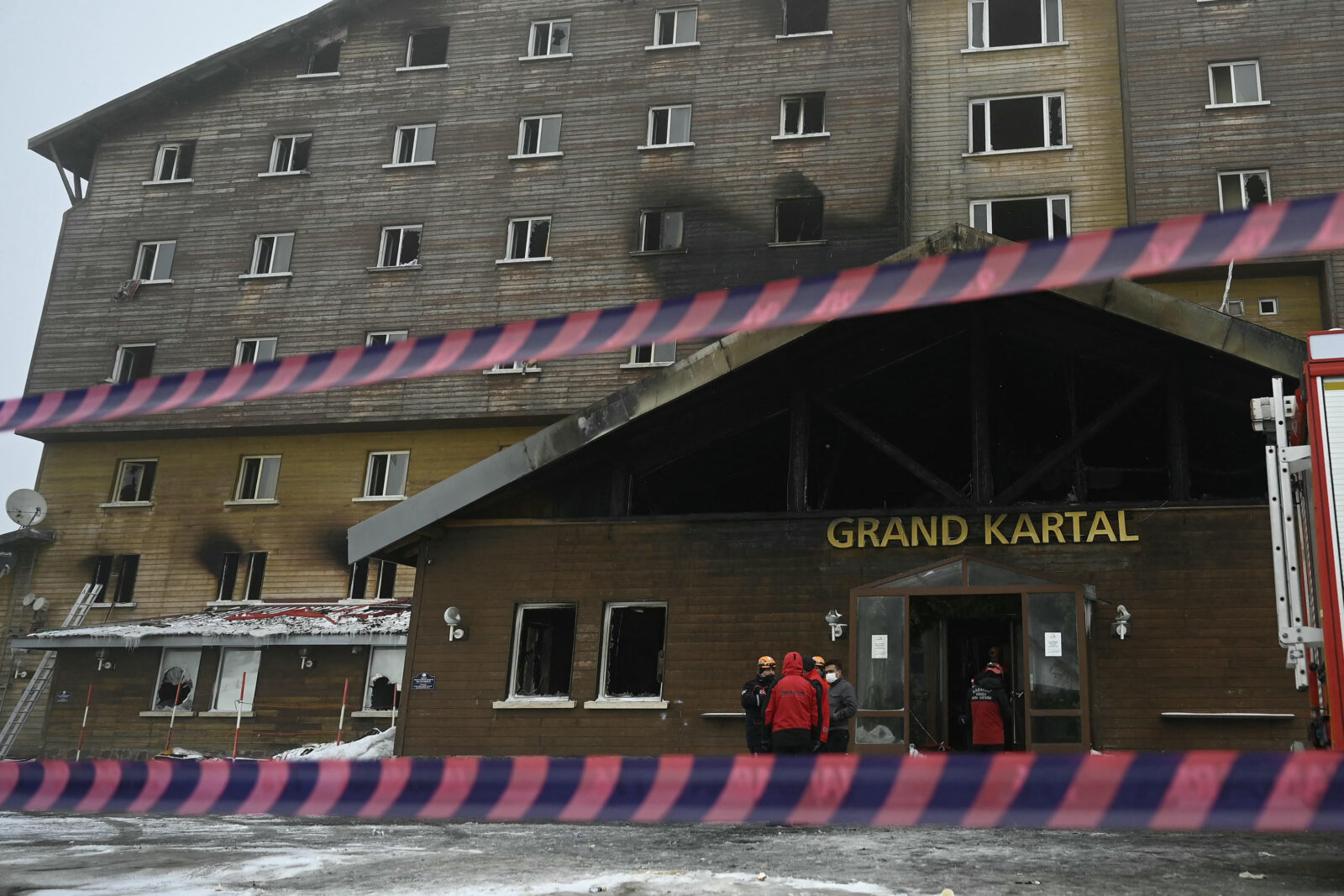 Turkish emergency personnel operate on the aftermath of a fire that broke out at the Grand Kartal Hotel
