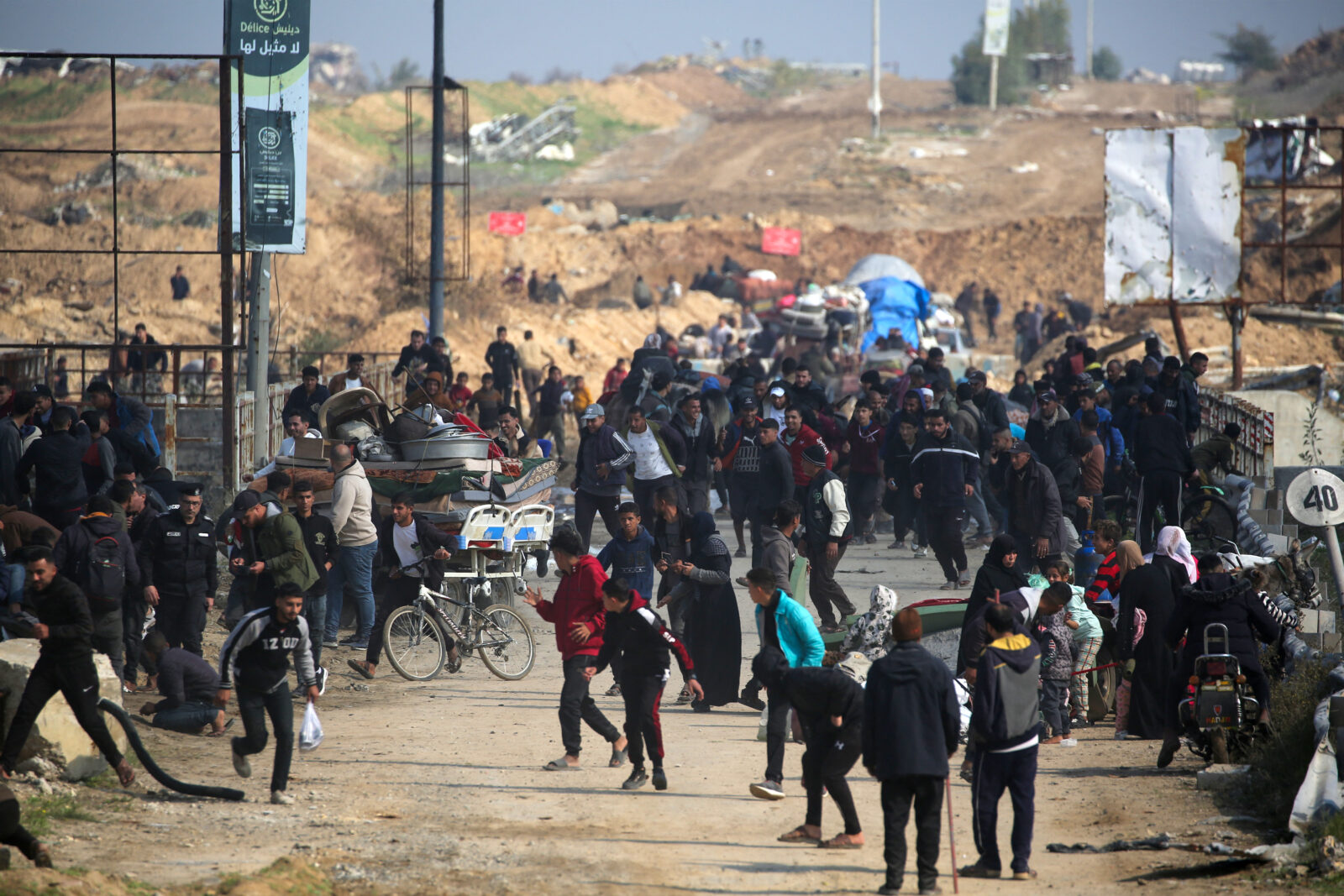 Photo captures displaced Palestinians running for cover