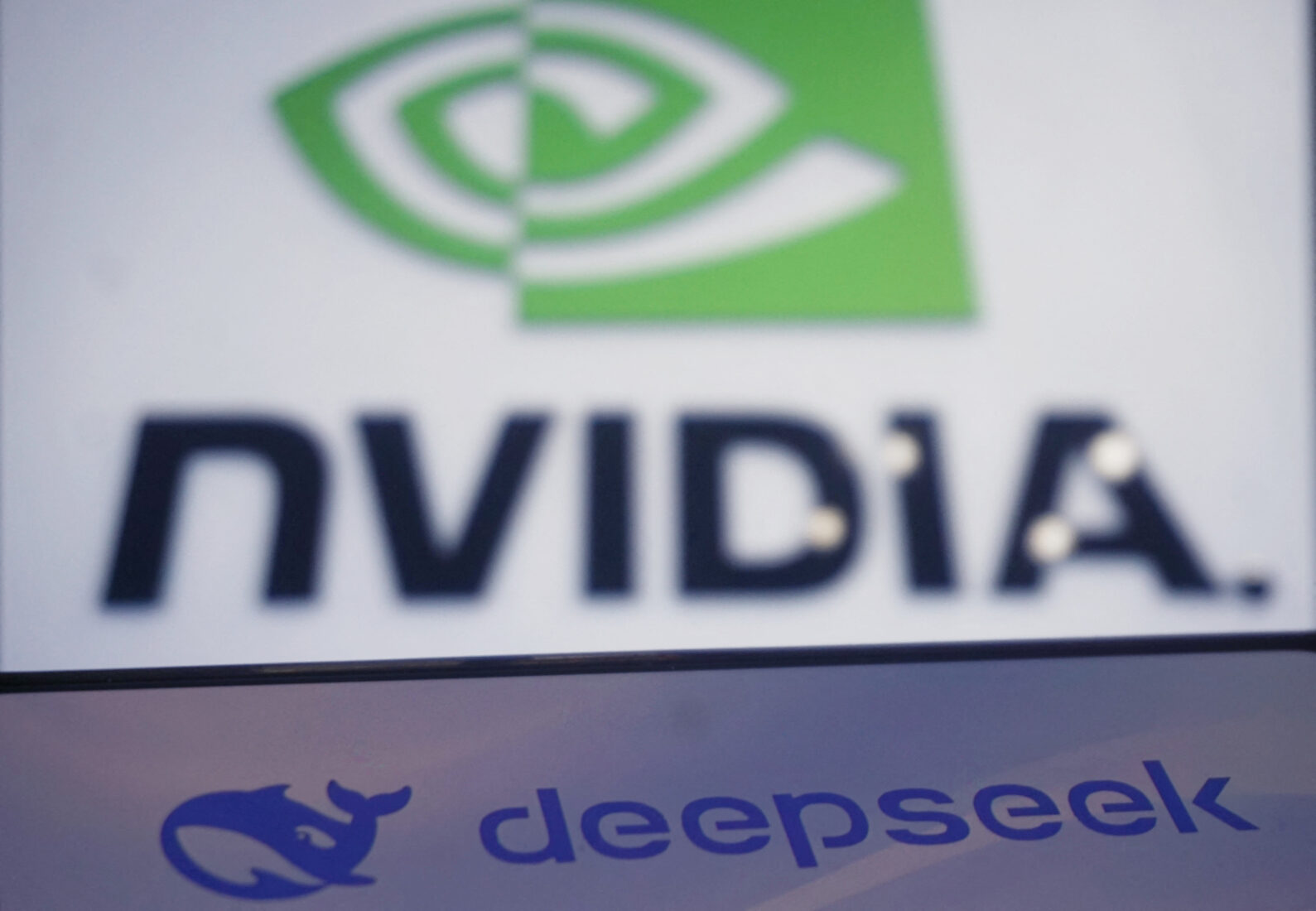 This photo illustration shows the DeepSeek and Nvidia logos on screens in Hangzhou, in China