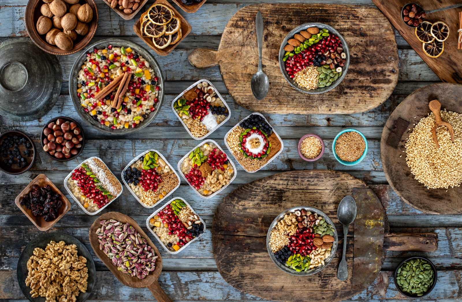 a table with several plates of asure, traditional Turkish dessert