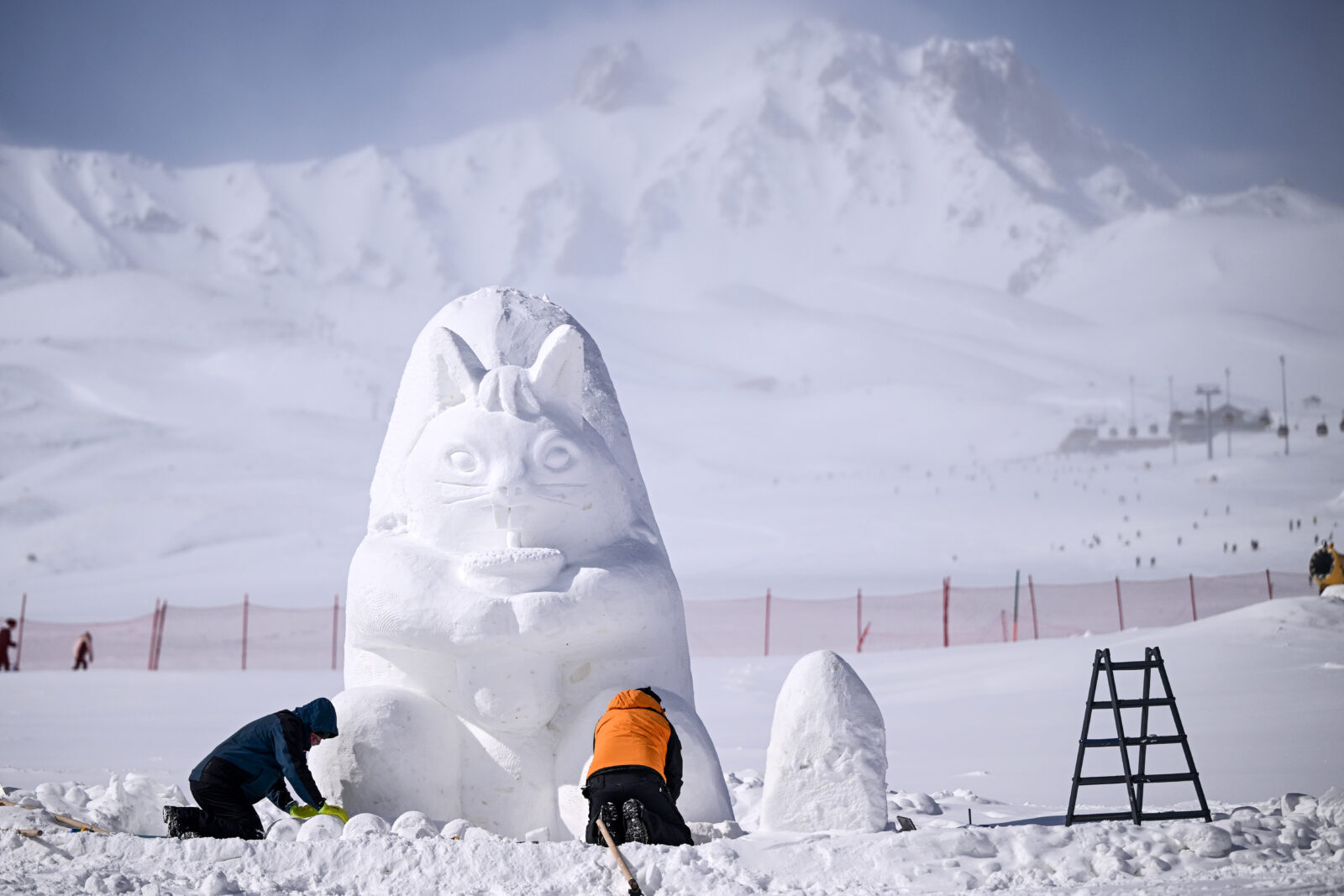 Sculptors creating animated characters from snow on Mount Erciyes, Kayseri, Türkiye.
