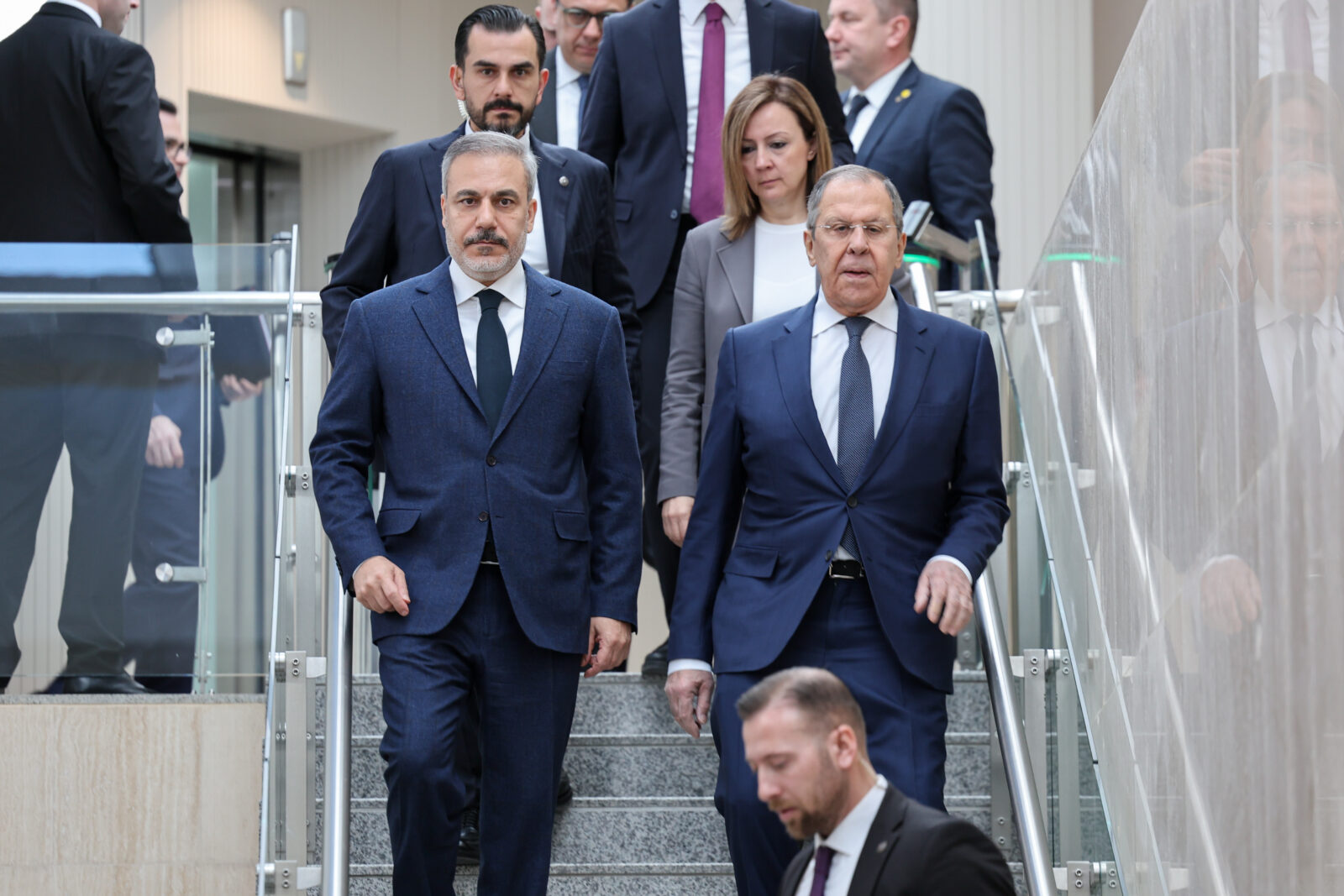 Photo shows Turkey Foreign Minister Hakan Fidan (L) walking down the stairs with Russian Foreign Minister Sergey Lavrov