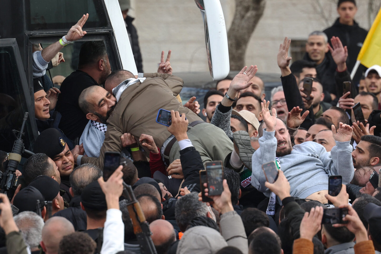 A former Palestinian prisoner released by Israel is welcomed upon arrival in Ramallah on an International Committee of the Red Cross (ICRC) bus