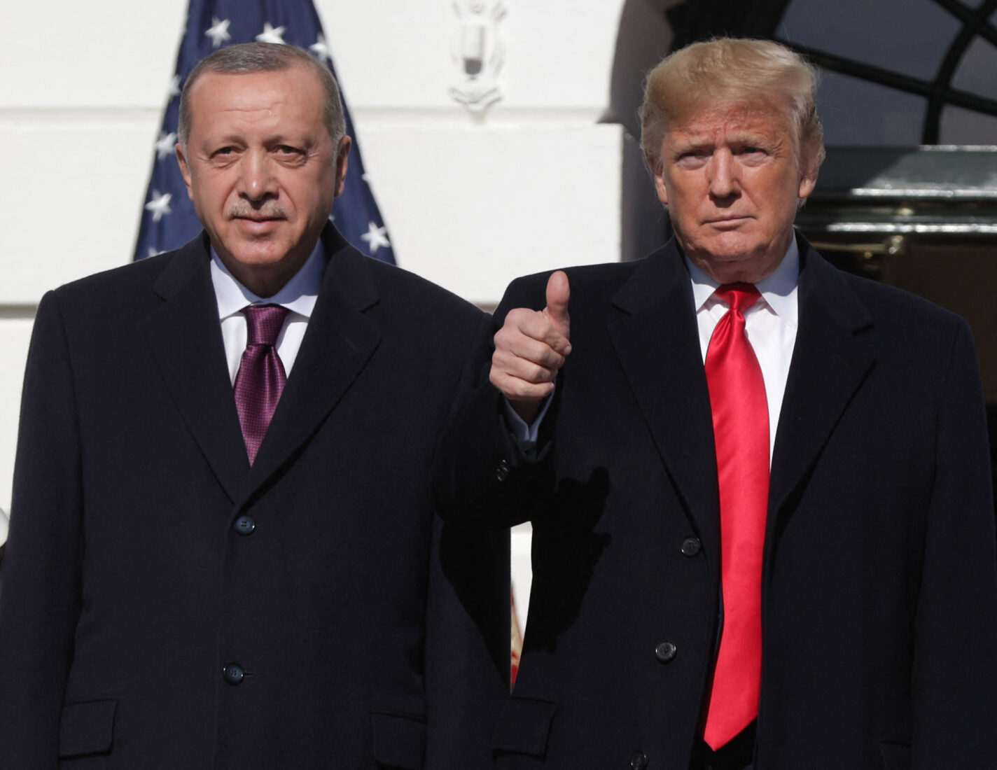 President Donald Trump (R) gives a thumbs up will greeting Turkish President Recep Tayyip Erdogan