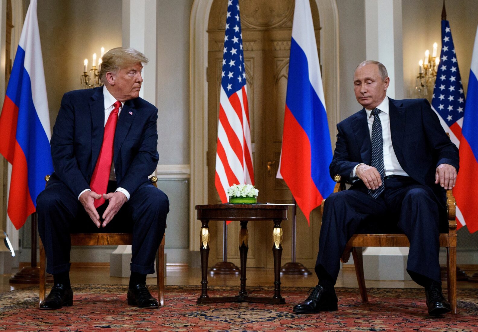 Photo shows Russian president Putin sitting alongside US President Donald Trump in Helsinki