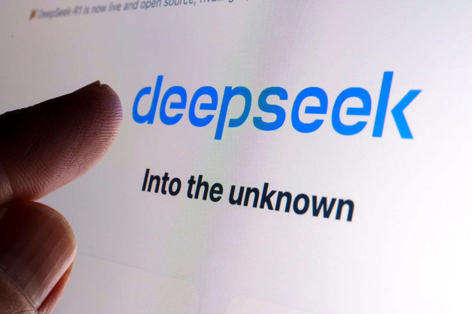 DeepSeek AI company logo seen on the screen and the finger touching it. Stafford, United Kingdom, January 26, 2025
