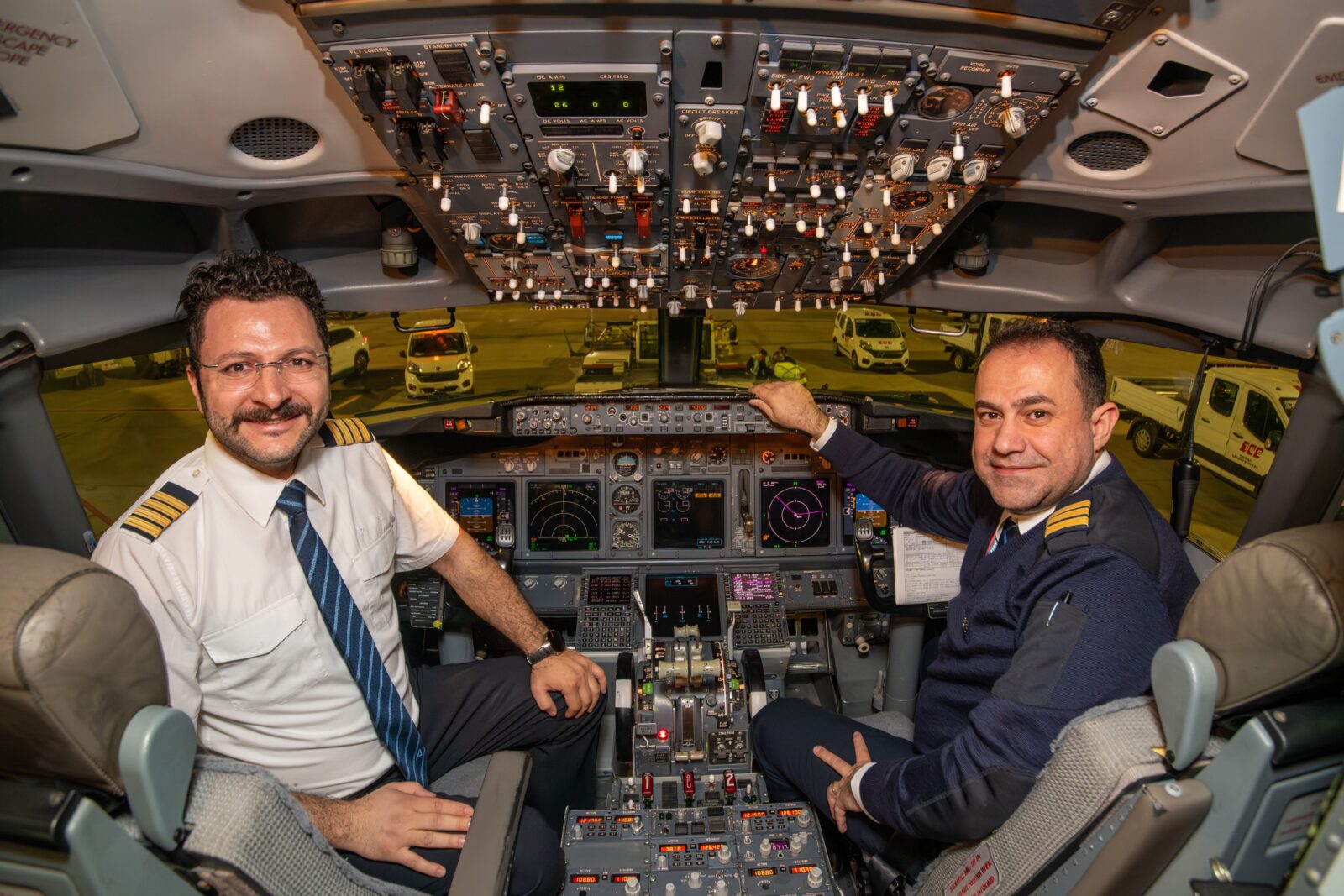 Two pilots in the cockpit of an AJet airplane