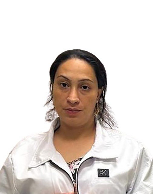 A mugshot of Ceylan Cicek wearing a white jacket, looking directly at the camera.