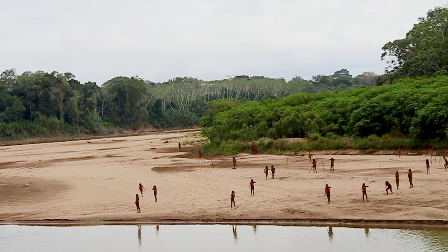 This June 2024 photo provided by Survival International shows members of the Mashco Piro along Las Piedras River in the Amazon near the community of Monte Salvado, in Madre de Dios province, Peru. (Photo via Survival International) uncontacted tribe