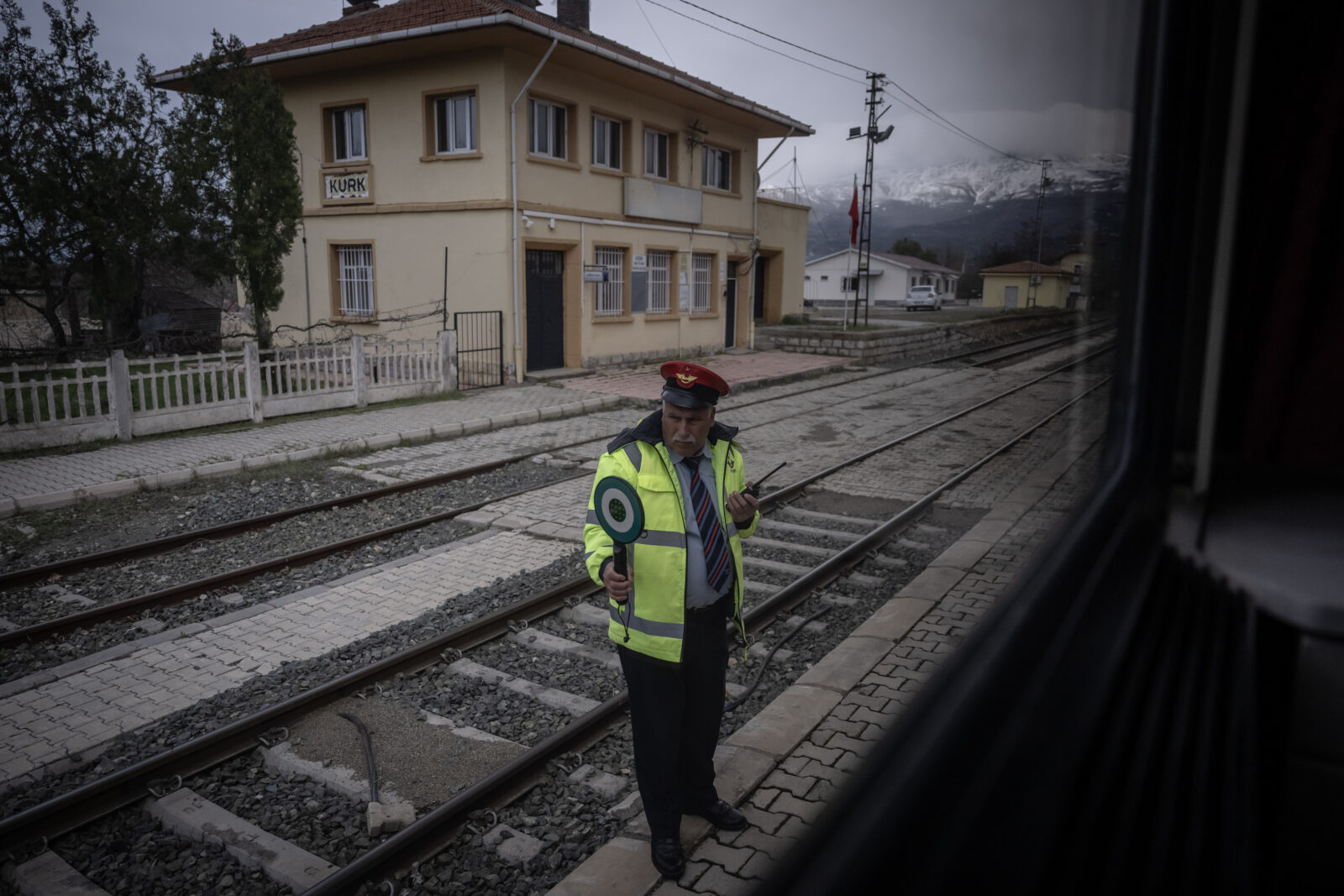 A railway officer is seen from the windows of 