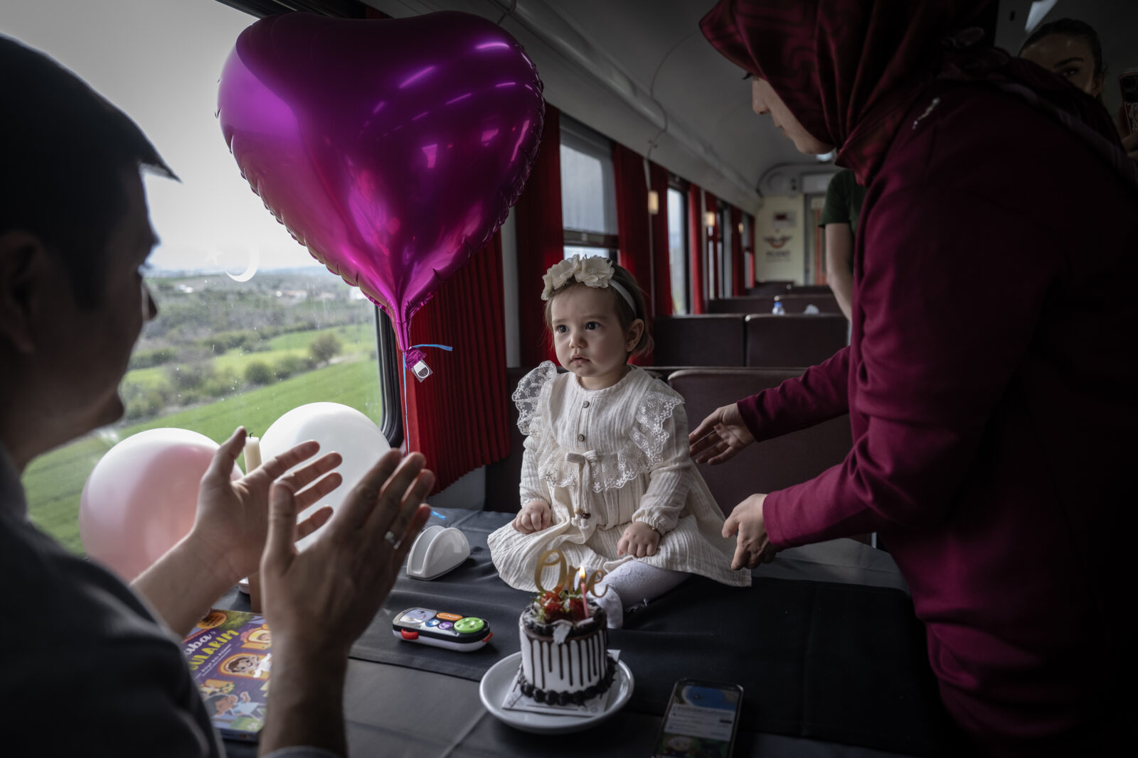 Passengers celebrate the birthday of a baby at 
