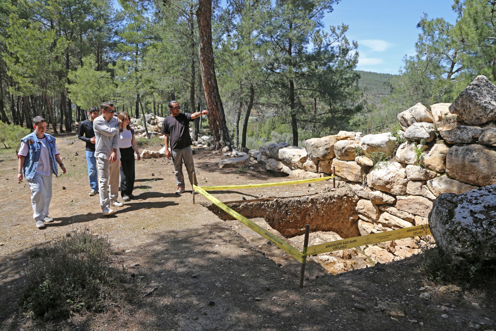 Archaeologists surveying ancient city walls in Hyllarima before excavations.