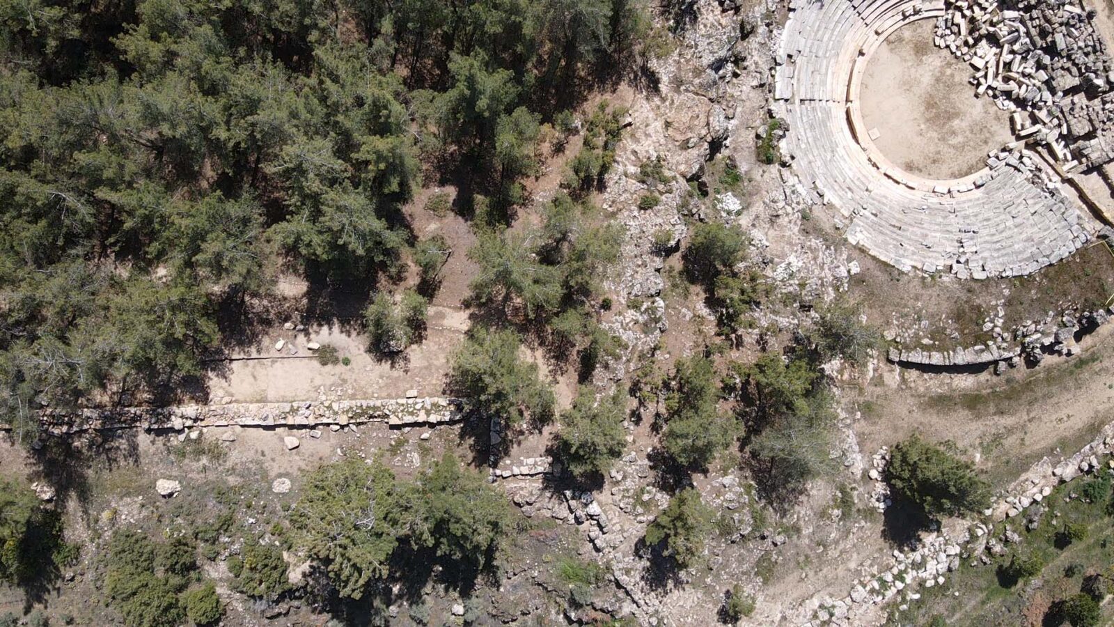 Aerial view of city walls and ancient theater in Hyllarima, Türkiye.