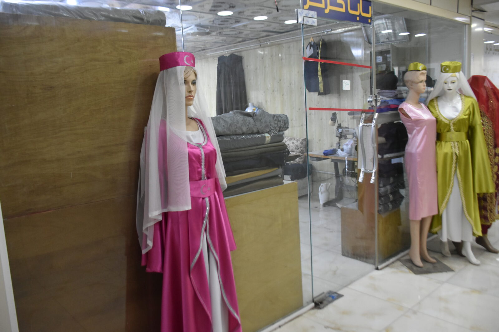 The traditional attire of Iraqi Turkmens is displayed on a mannequin for sale at a tailor