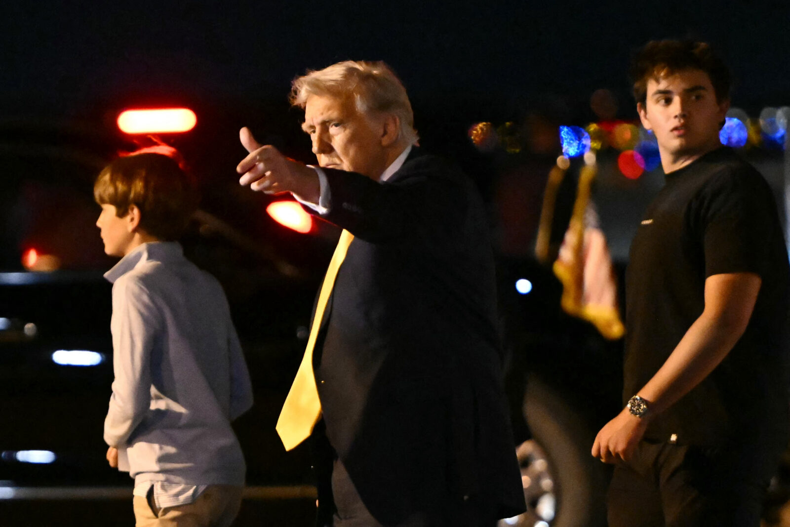 US President Donald Trump gestures upon arriving at Palm Beach