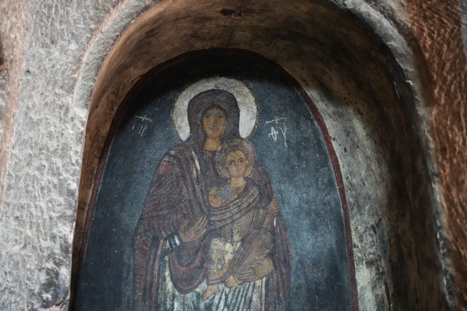 Detail of colorful frescoes inside Gümüşler Monastery in Cappadocia, Nigde, Türkiye.