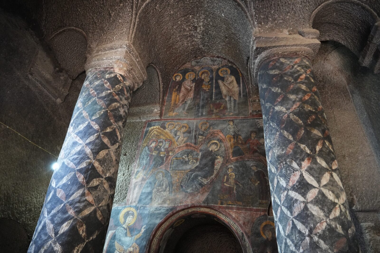 Detail of colorful frescoes inside Gümüşler Monastery in Cappadocia, Nigde, Türkiye.