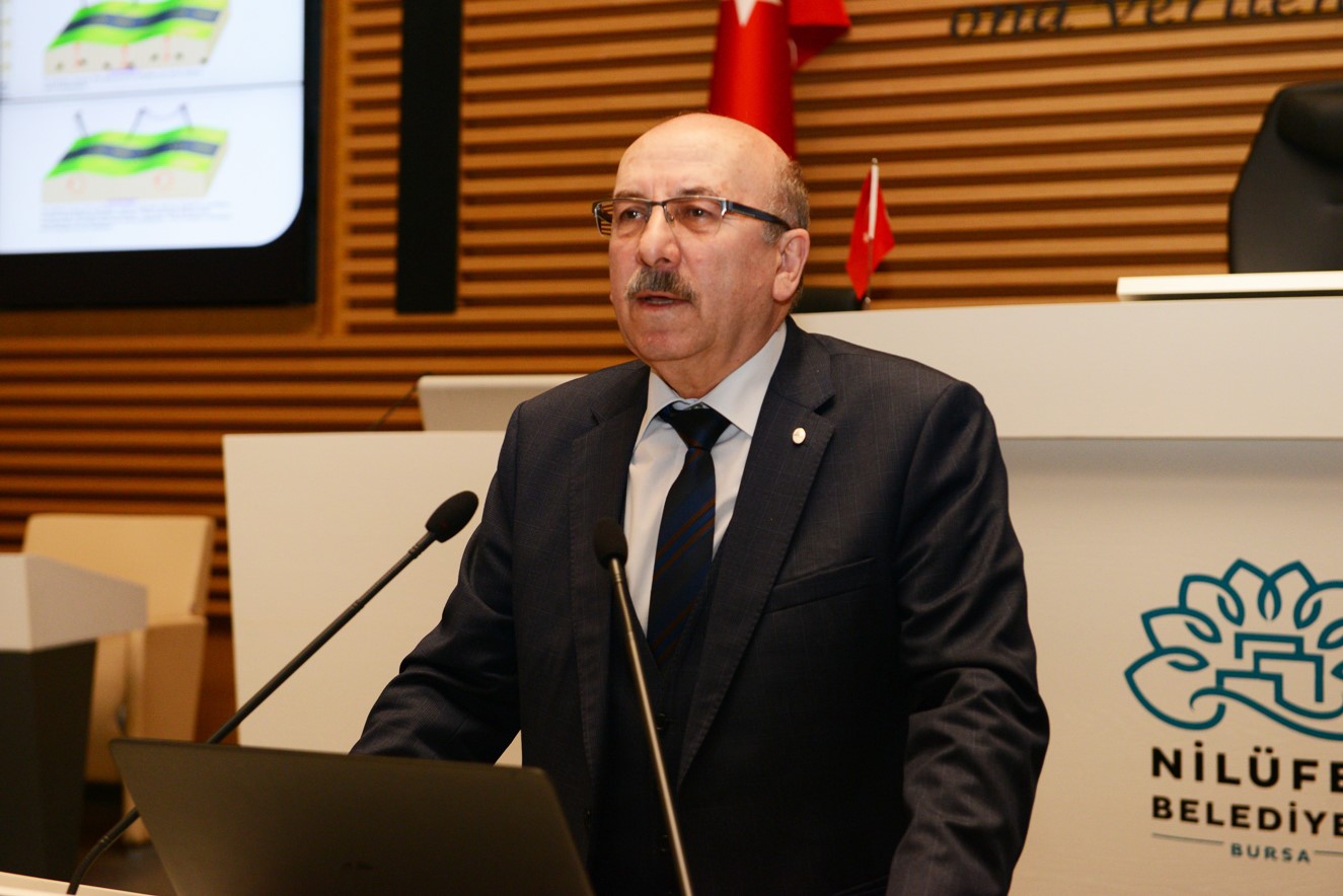Professor Okan Tuysuz speaks at a conference 
