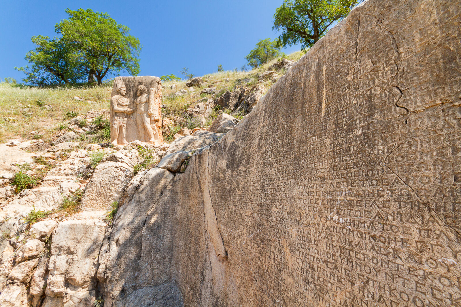 Greek inscriptions and the relief of Hercules and King Antiochus, of Commagene Kingdom in the ancient site of Arsemia, Mt Nemrut, Adiyaman, Turkey.