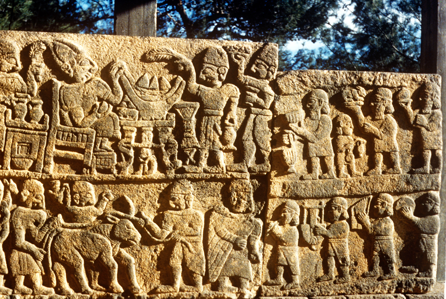 Luwian reliefs with a banquet scene, food carriers, and musicians at Karatepe-Aslantas in southern Turkey.
