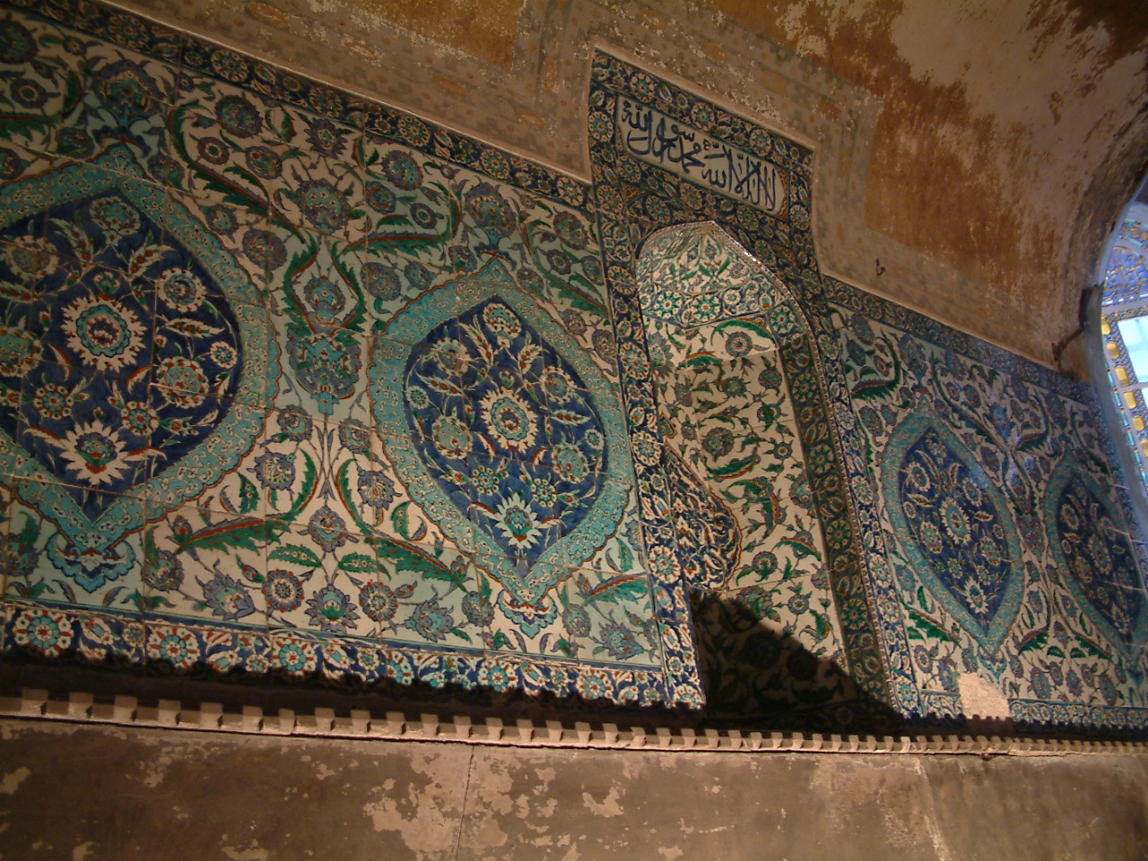 This tile panel with floral motifs is found at the Narthex on the left side of the Altar