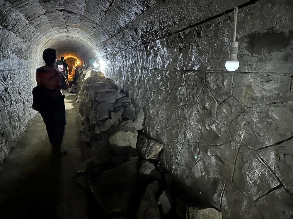 Visitors walking inside a World War II-era tunnel at Haydarpasa Train Station in Istanbul.
